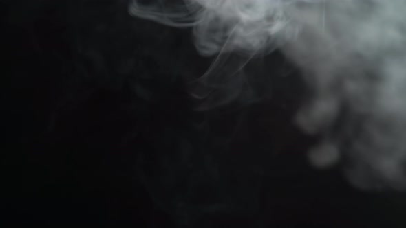 Smoke Floating Against Black Background