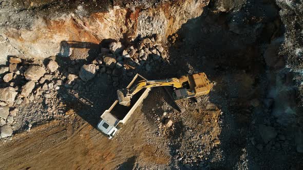 Excavator Fills Dump Truck