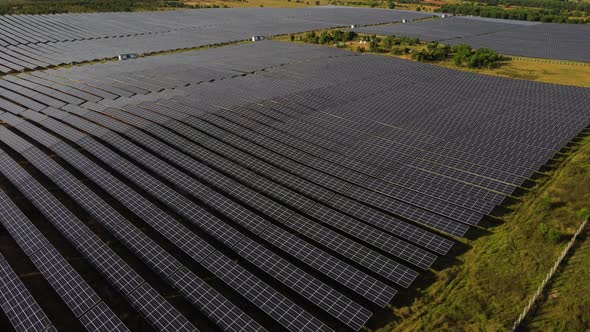 Drone Flying Over A Solar Farm With Several Arrays Of Solar Panels In Vietnam. - Drone Orbit Shot