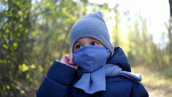 Boy Walks in a Mask Protected From the Virus