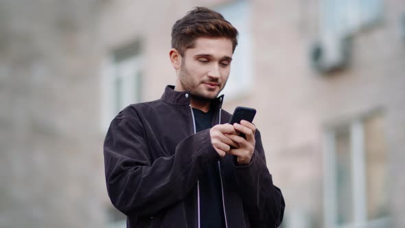 Happy Man Using Phone Outside, Smiling Guy Chatting Via Phone Outdoors