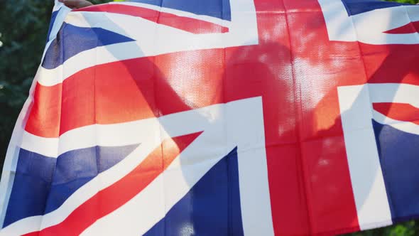 Happy girl with the United Kingdom national flag