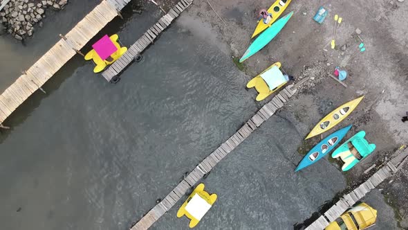 Drone footage by the pier, colourful boats