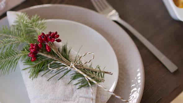 Decorated Linen Napkin on Plate on Christmas Table