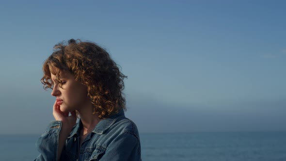 Sad Woman Standing on Sea Beach