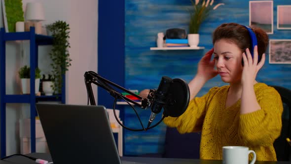 Creative Influencer with Headphones Ready to Speak During Podcast