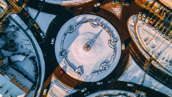 Aerial View Timelapse of Roundabout Road with Circular Cars in Small European City at Sunny Winter