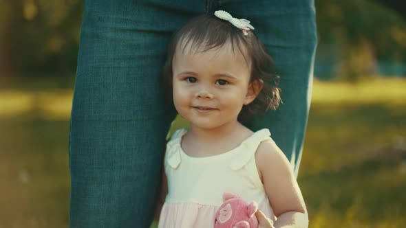 Daughter Near Daddy's Feet on Nature