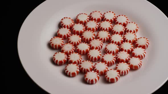 Rotating shot of peppermint candies - CANDY PEPPERMINT 026