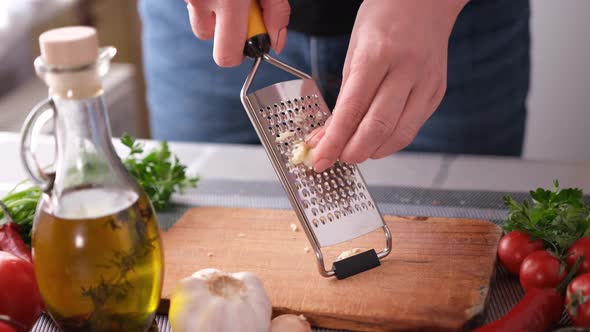 Making Salad Sauce  Grating Garlic at a Domestic Kitchen