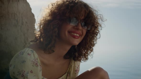 Positive Girl Laughing Looking Camera at Blue Sea Close Up