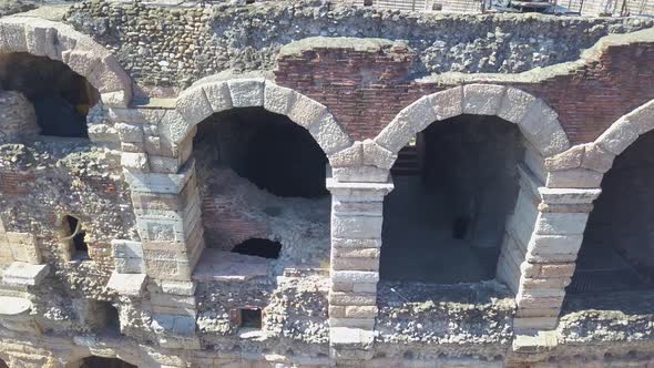 Aerial panoramic view of Arena di Verona,Italy.The drone flies near the wall and arches of the Arena