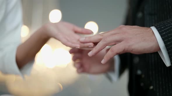 Closeup of a Man and a Woman Touching Hands