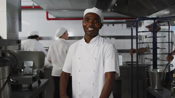 Portrait of african american male chef with arms crossed looking at camera