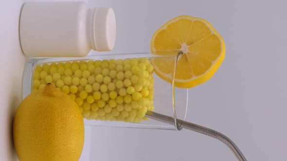 Vertical orientation video: Vitamin C to improve immunity. Ascorbic acid and lemon