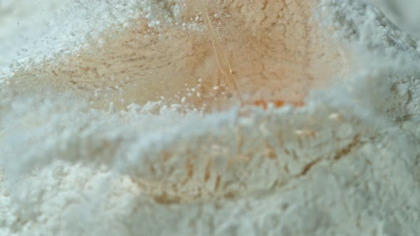 Super Slow Motion Shot of Falling Egg Into Flour at 1000Fps.