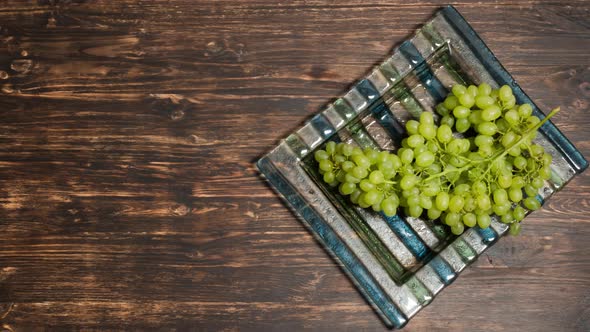 Bunch of Grapes Lying on a Plate, Top View