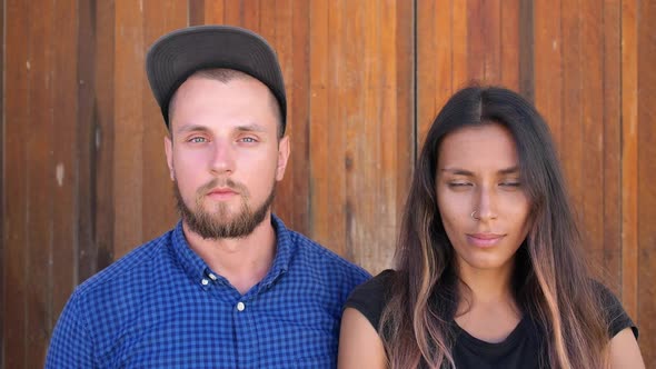 Beautiful Young Mixed Race Couple Looking at Camera