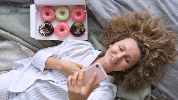 Young Woman At Home Making A Video Call Using Smart Phone