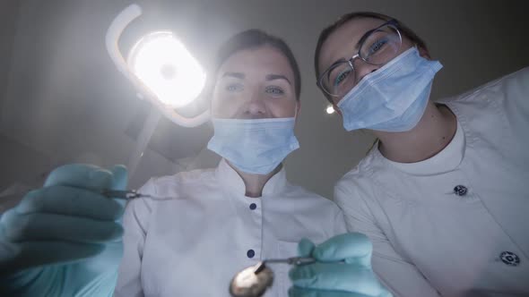 POV Shot of Patient Seeing Female Dentist During Treat Procrdure