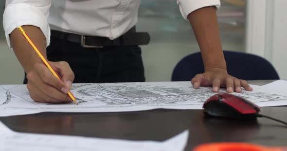 Architects Working With Blueprints In The Office alt