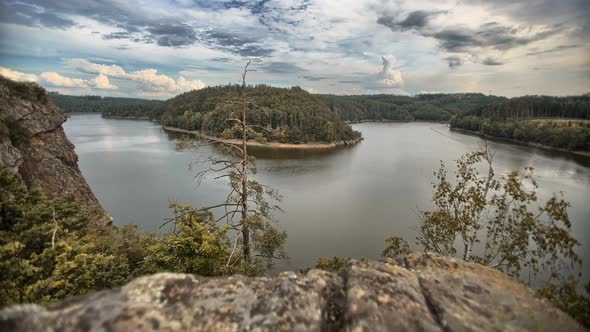 Beautiful winding dam in the middle of nature. Czech republic, time lapse