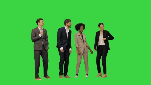 A Group of Young People in Business Suits Dancing on a Green Screen Chroma Key