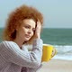 Beautiful Pensive Redhead Woman at the Beach Watching the Sea - VideoHive Item for Sale