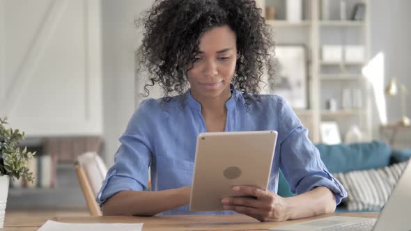 Online Shopping on Tablet By African Woman