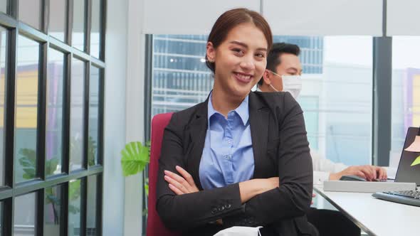 Portrait of business woman remove mask, work in office with new normal social distancing lifestyle.