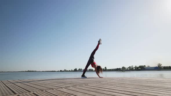 yoga woman preparing handstand split pose Fitness lifestyle exercising outdoor