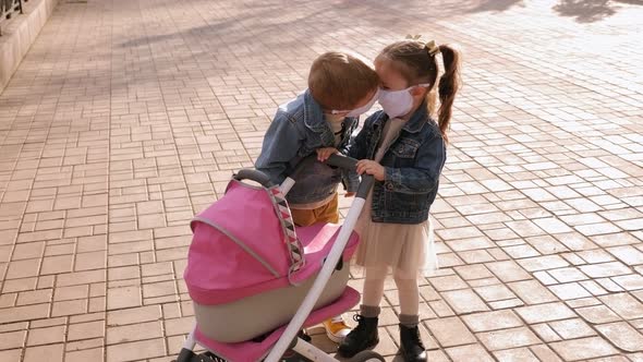 A Little Boy Kisses a Girl in the Park, the Children Wear Medical masks.COVID-19