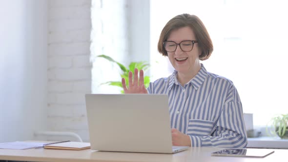 Online Video Call By Senior Woman in Office