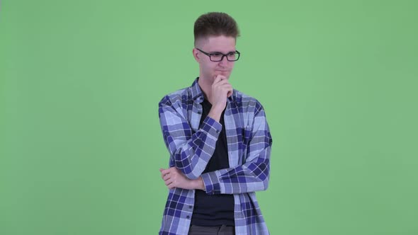 Stressed Young Hipster Man Thinking and Looking Down