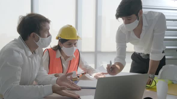 group of engineer caucasian male and asian female serious concentrate meeting
