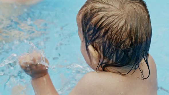 Cute Little Child Bathing in Blue Street Pool in Courtyard. Portrait of Joyful Toddler, Baby. Kid