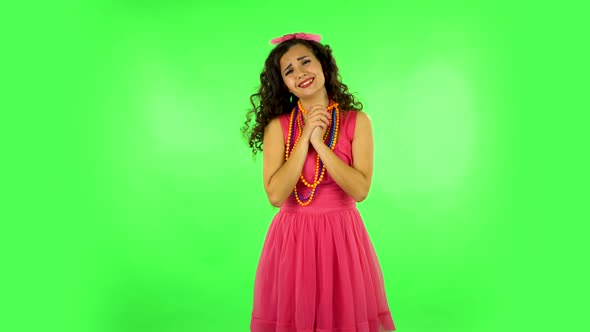 Curly Girl with Wow Face Expression and Tender Smiling. Green Screen at Studio