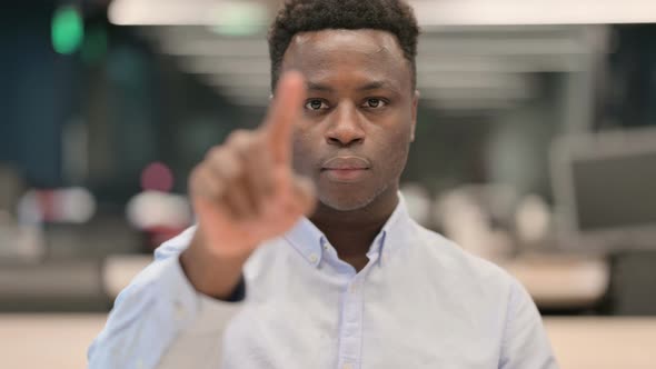 Portrait of African Businessman Pointing at the Camera