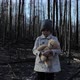 Little girl with teddy bear in burnt forest - VideoHive Item for Sale