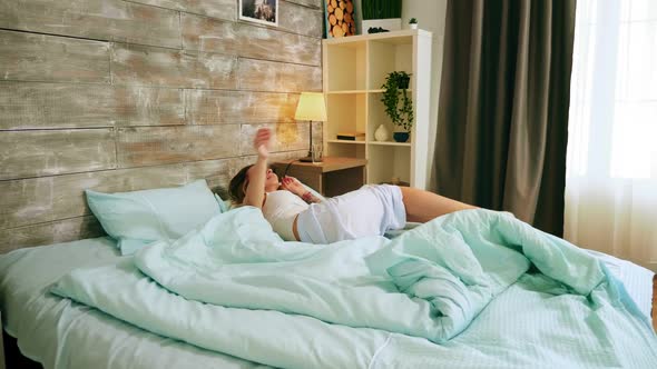 Happy Sleepy Young Adult Woman Waking Up