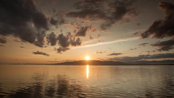 Timelapse Footage of Sunset Over Water with Clouds