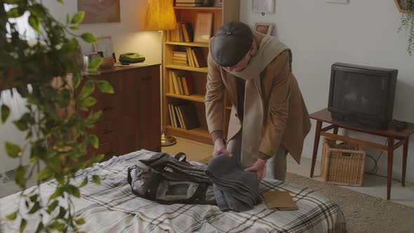 Senior Man Packing Sports Bag