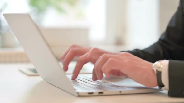 Close Up of Hand of Middle Aged Businessman with Laptop Showing Frustration