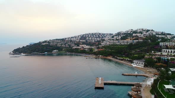 Flight over the coast of Bodrum, against the background of hotels, Turkey