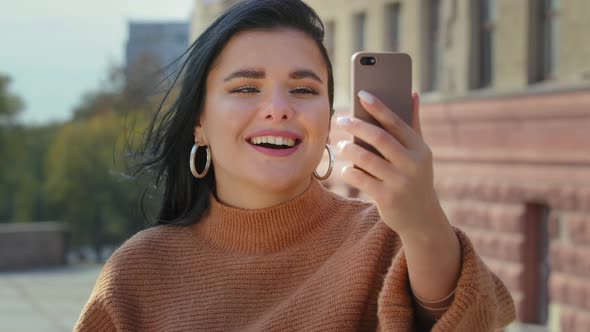 Closeup Happy Young Woman in City Outdoors Communicating By Video Call Online From Mobile Gadget