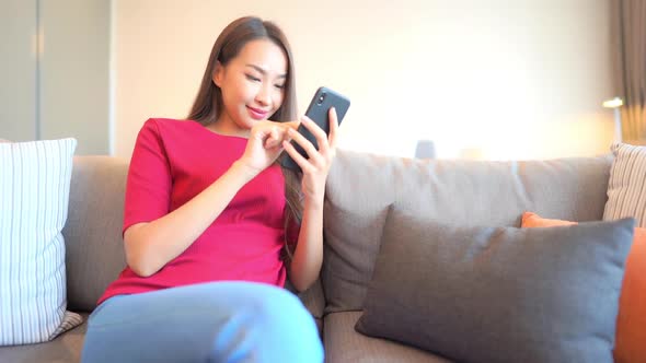 Young asian woman use smart phone