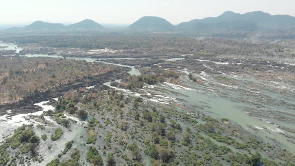 Aerial: flying over Li Phi waterfall, the 4000 islands Mekong River in Laos