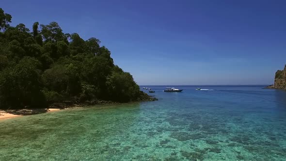 Aerial view of boats moored in the bay of Koh Rok Yai island in Thailand.