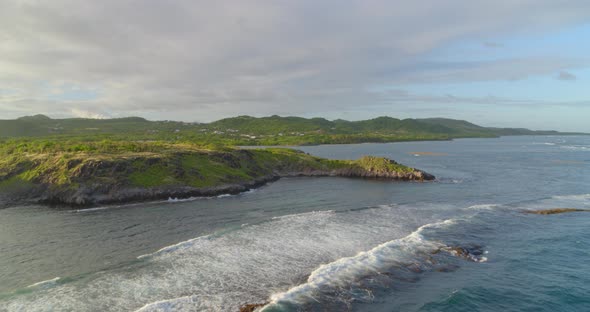 Aerial of green landscape along sea coast, Cap Chevalier, Sainte-Anne