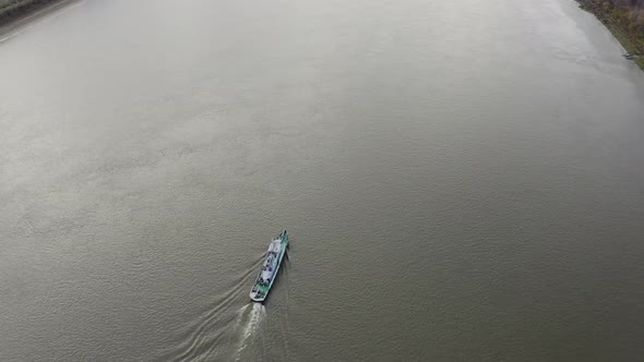 The Camera Shoots a Yacht on the River From Above